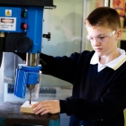 Pupil using a drill
